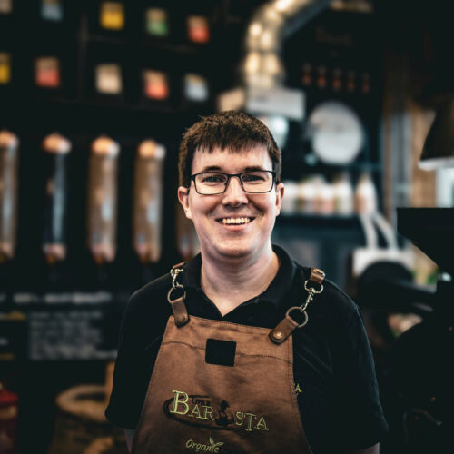 Alex the barista at Little Barista – crafting coffee behind the bar in a specialty coffee shop