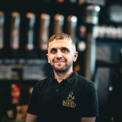 Alex the barista at Little Barista – crafting coffee behind the bar in a specialty coffee shop