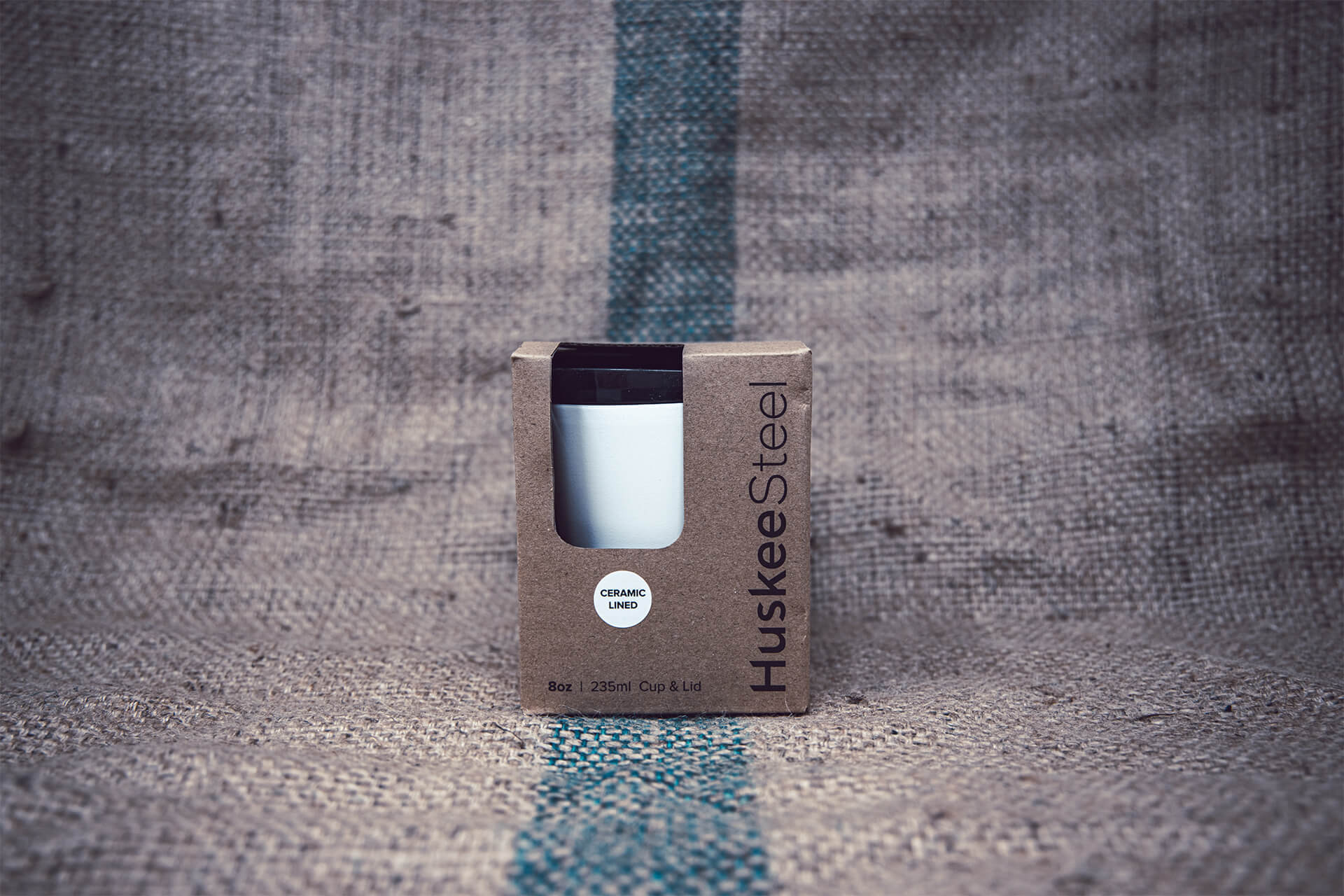 Huskee Steel ceramic-lined reusable coffee cup with universal lid – sustainable insulated travel mug